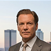 a photograph of a distinguished german businessman standing confidently in a modern office setting